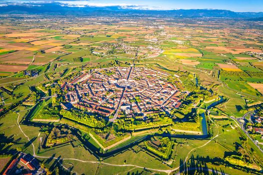 Star shape town of Palmanova defense walls and trenches aerial panoramic view, UNESCO world heritage site in Friuli Venezia Giulia region of northern Italy