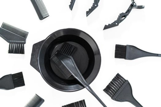 Black hair color dye kit with mixing bowl on a white background.