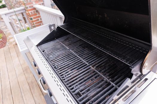 Clean six-burner gas grill ready for summer grilling.
