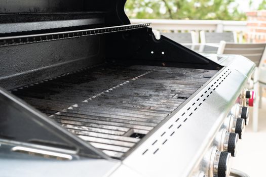 Clean six-burner gas grill ready for summer grilling.