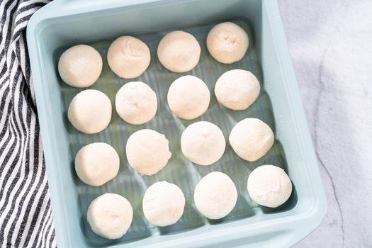 Baking dinner rolls from the premade frozen dough in the baking pan.
