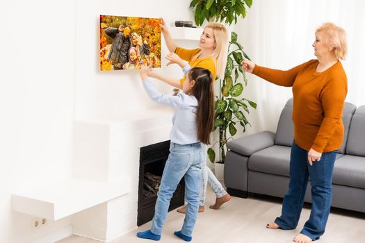 little girl holding photo canvas with autumn. Beautiful girl with canvas