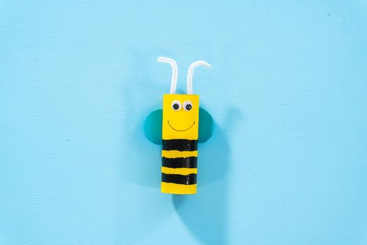 Papercraft project. Colorful bugs made out of empty toilet rolls.