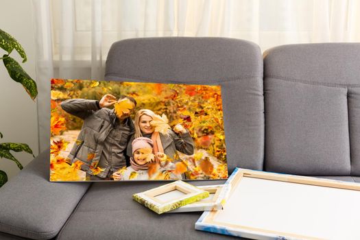 photo canvas with a family in autumn.