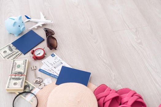 dollars, piggy bank, alarm clock, hat, glasses. Time to go on holiday. Things for summer trip