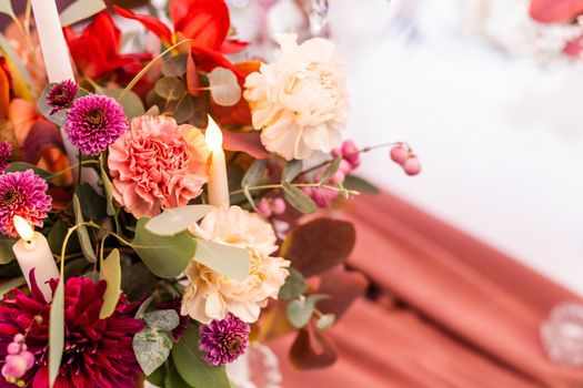 red autumn bouquet on the festive table.