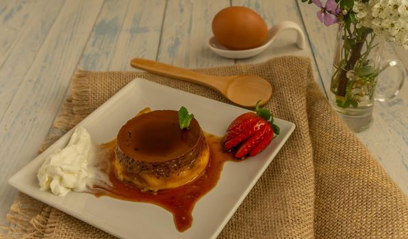 egg custard with cream and strawberries delicatessen