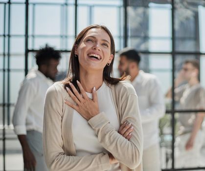 Face of beautiful woman on the background of business people