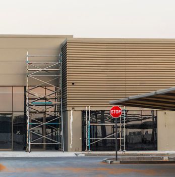 Shot of a empty parking and building under final stages of construction