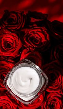 Anti-age moisturizer, luxe cosmetics and organic science concept - Moisturizing beauty face cream for sensitive skin and red roses flowers, luxury clean skincare cosmetics on floral background