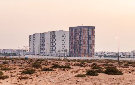 Dubai, UAE - 09.27.2022 - Shot of a modern buildings in Dubai South district