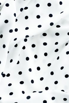 Fashion design, interior decor and vintage material concept - Classic polka dot textile background texture, black dots on white luxury fabric design pattern