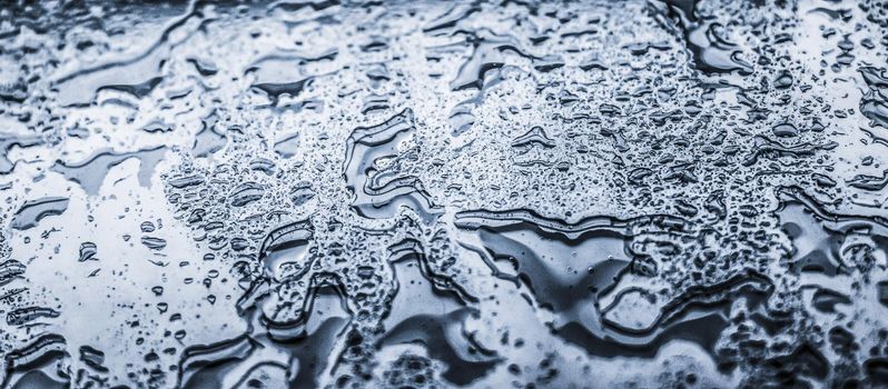 Liquid, wet and zen concept - Water texture abstract background, aqua drops on silver glass as science macro element, rainy weather and nature surface art backdrop for environmental brand design