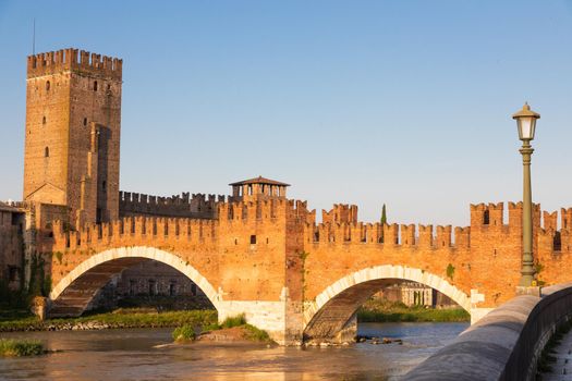 Verona, Italy. Castelvecchio bridge on Adige river. Old castle sightseeing at sunrise