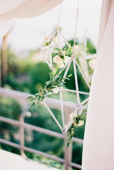 Diamond-shaped wicker decorations on the wedding arch. High quality photo