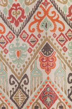 Vertical background: old multicolored fabric with patterns.