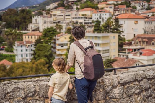 Father and son tourists in Herceg Novi old town. Historical and touristic center of Herceg Novi. Montenegro.