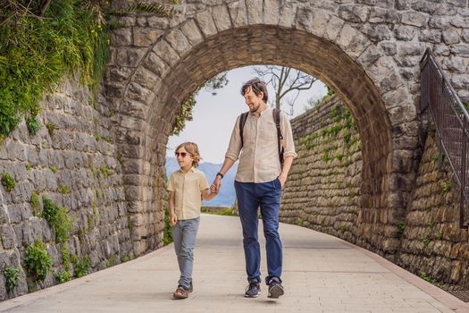 Father and son tourists in Herceg Novi old town. Historical and touristic center of Herceg Novi. Montenegro.