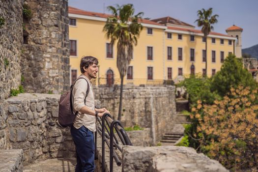 Man tourist in Herceg Novi old town. Historical and touristic center of Herceg Novi. Montenegro.