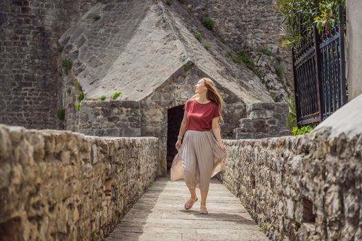 Woman tourist in Herceg Novi old town. Historical and touristic center of Herceg Novi. Montenegro.