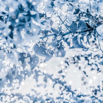 Magical, branding and festive concept - Christmas, New Years blue floral nature background, holiday card design, flower tree and snow glitter as winter season sale backdrop for luxury beauty brand