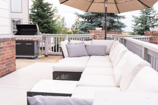 Patio of a luxury single-family home furnished with modern furniture.