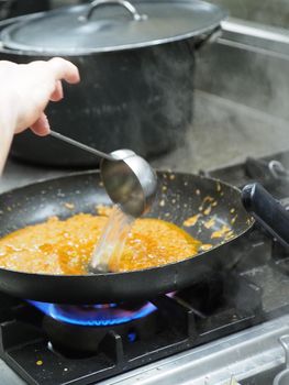 preparing autumn mushroom sauce for tagliatelle pasta- italian food