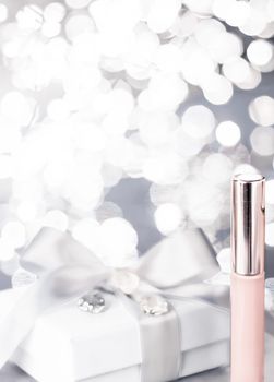 Cosmetic branding, Christmas glitter and girly blog concept - Holiday make-up foundation base, concealer and white gift box, luxury cosmetics present and blank label products for beauty brand design