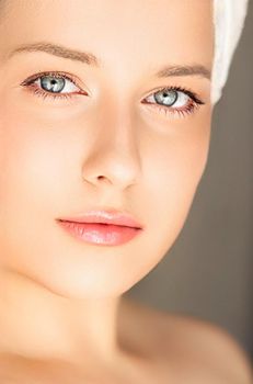 Skin care and beauty routine, beautiful woman with white towel wrapped around head, skincare cosmetics and face cosmetology, close-up portrait