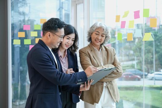 Young Asian woman leading business creative team entrepreneur have small team meeting for upcoming project for marketing and sale management