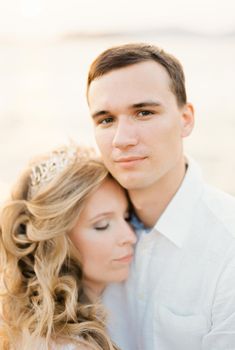 Bride rested her head on the groom shoulder. Portrait. High quality photo