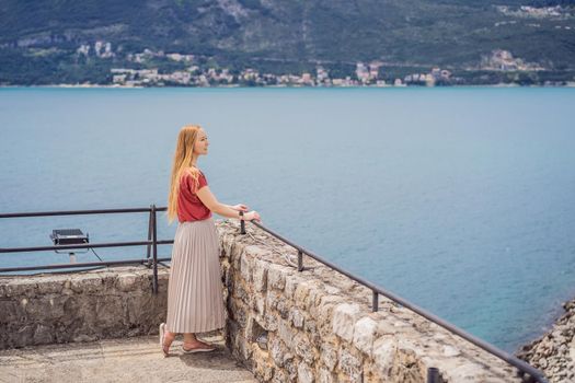 Woman tourist in Herceg Novi old town. Historical and touristic center of Herceg Novi. Montenegro.