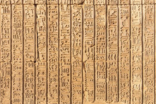 Part of the temple of Kom Ombo with hieroglyphs engraved on the wall