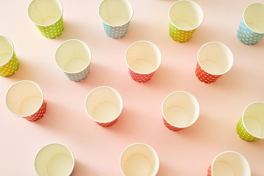 paper fashion cups on a delicate pink background