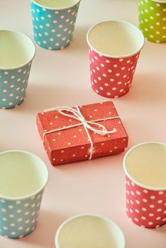 Flatlay with gifts in wrapped boxes top view on pastel color background
