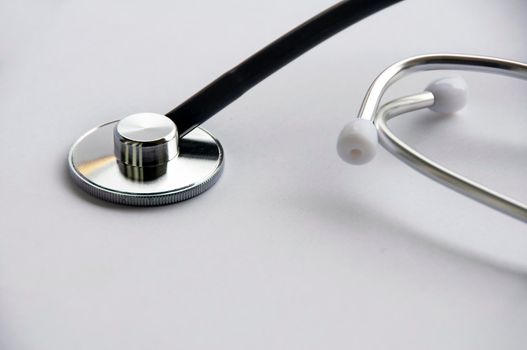 Stethoscope on white cover background with customizable space for text. Copy space and health concept.