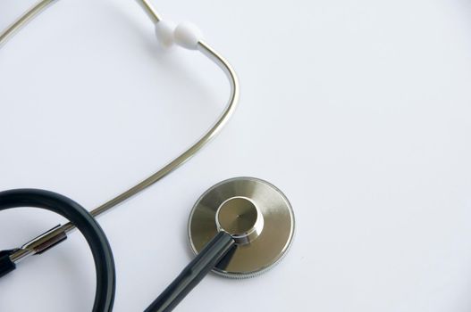Stethoscope on white cover background with customizable space for text. Copy space and health concept.