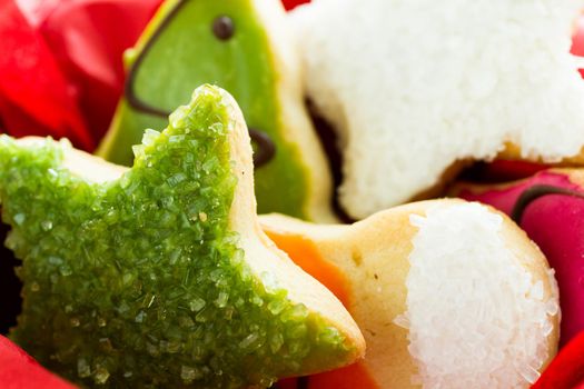 Assorted christmas cookies on red background.