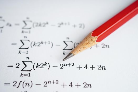 Pencil on mathematic formula exercise test paper in education school.