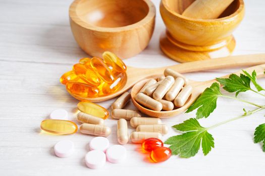 Alternative medicine herbal organic capsule with vitamin E omega 3 fish oil, mineral, drug with herbs leaf natural supplements for healthy good life.