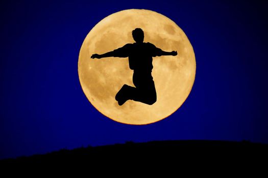 A young man jumping to the moon. Shooting Location: Tokyo metropolitan area