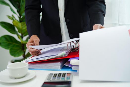 Business woman busy working with documents in office.