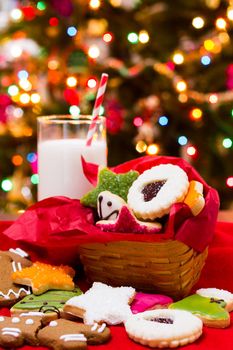 Assorted christmas cookies on red background.