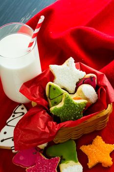 Assorted christmas cookies on red background.