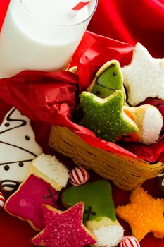 Assorted christmas cookies on red background.