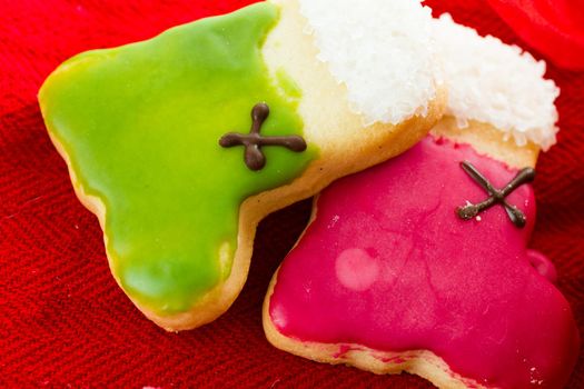 Assorted christmas cookies on red background.