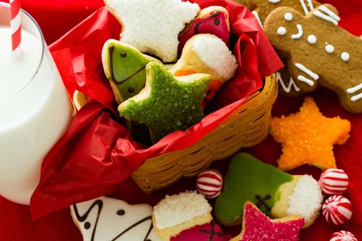 Assorted christmas cookies on red background.