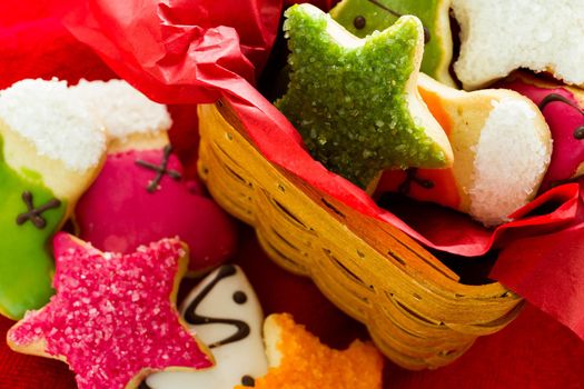 Assorted christmas cookies on red background.