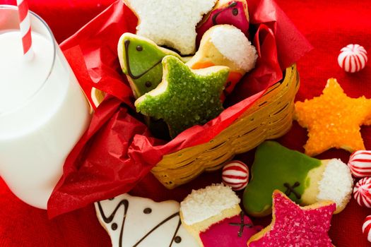 Assorted christmas cookies on red background.