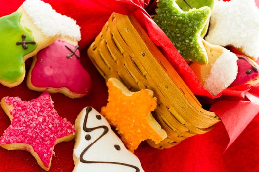 Assorted christmas cookies on red background.